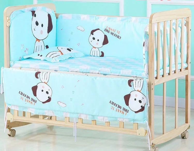 Wooden baby crib with light blue bedding featuring cute dog illustrations and musical notes. The bedding reads "I want to sing merrily." Crib has wheels for mobility.