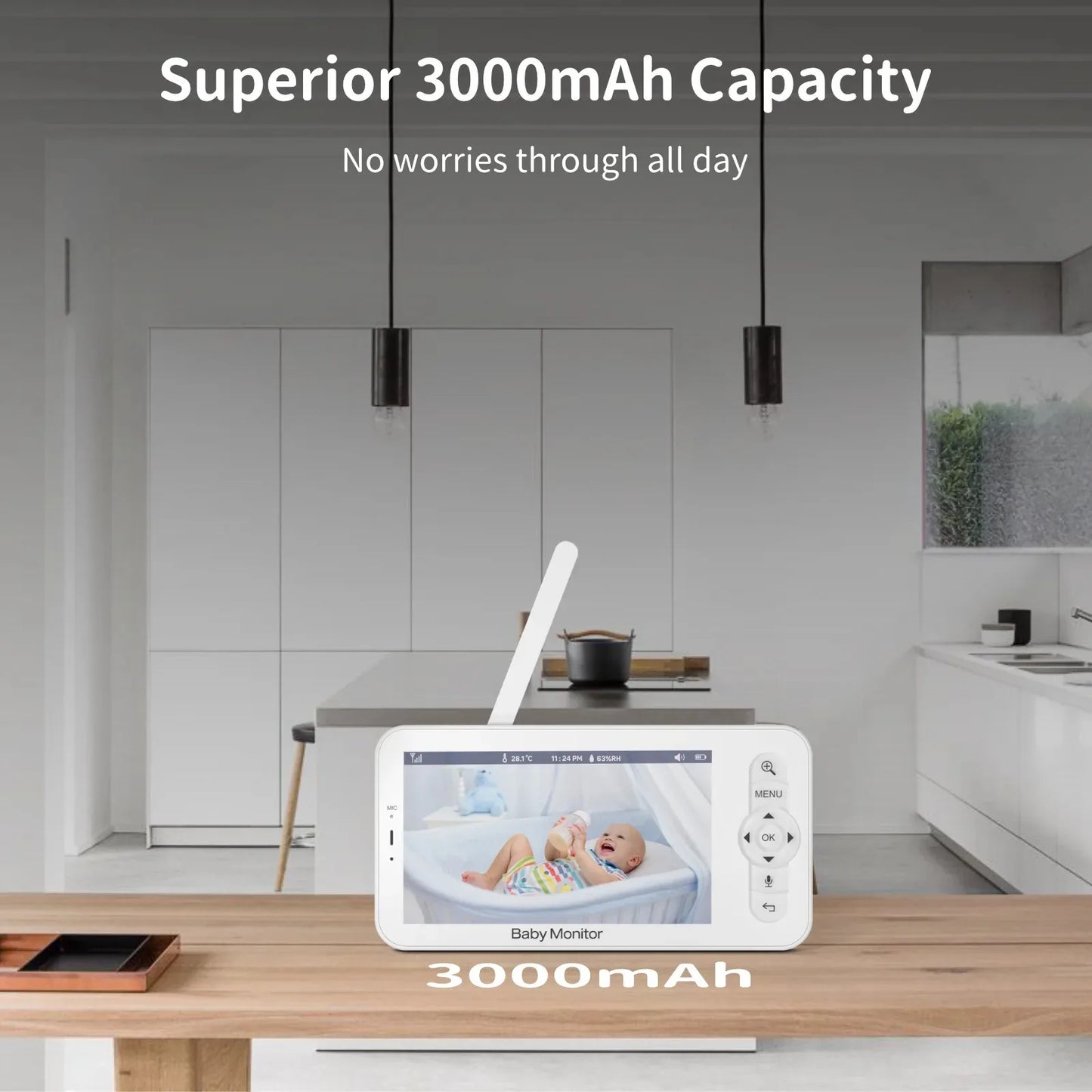 A baby monitor with a 3000mAh battery displayed on a wooden table in a modern kitchen. The screen shows a baby in a crib. Text highlights "Superior 3000mAh Capacity."