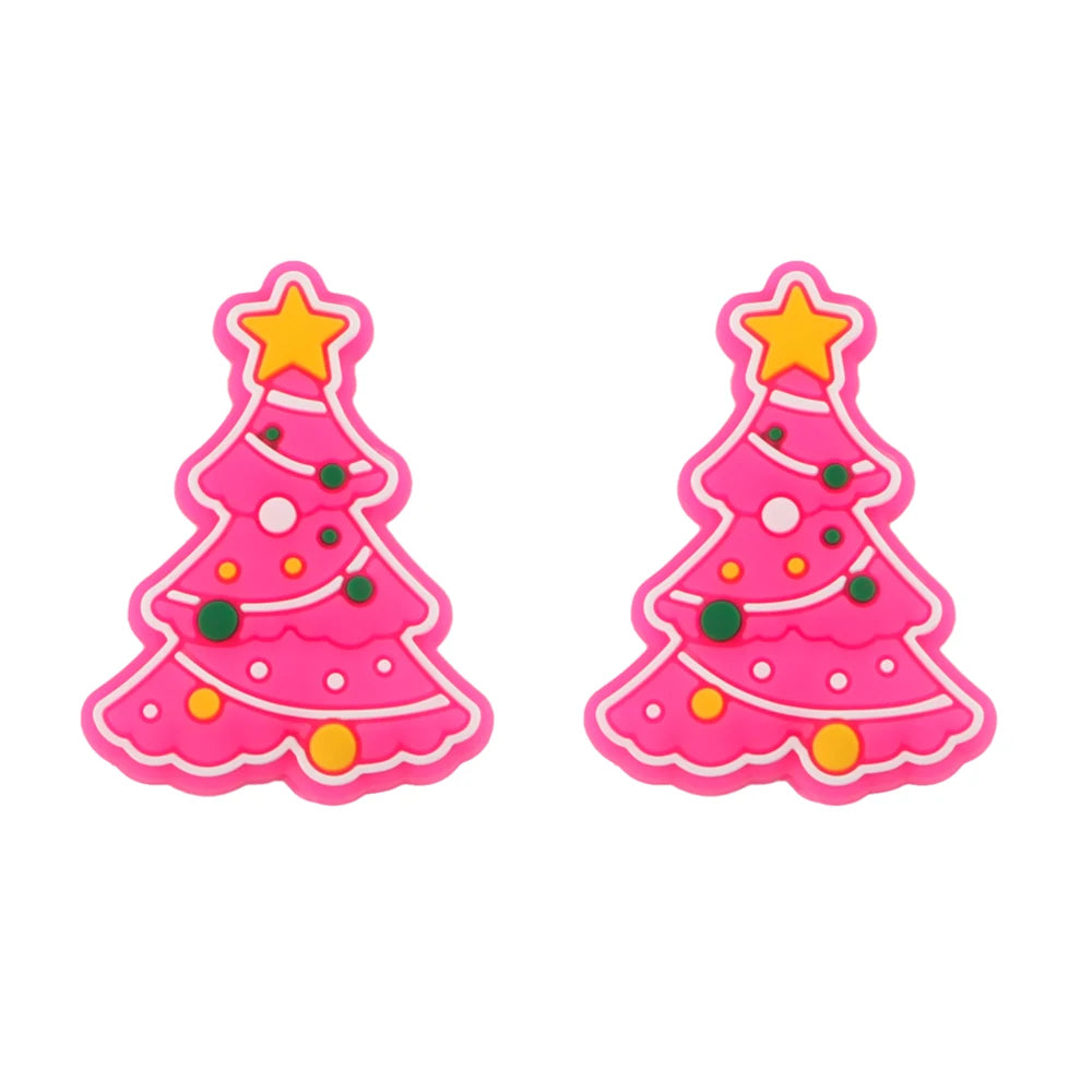 Two pink Christmas tree decorations with colorful ornaments and a yellow star on top. The trees have a cartoon-like appearance and are side by side.