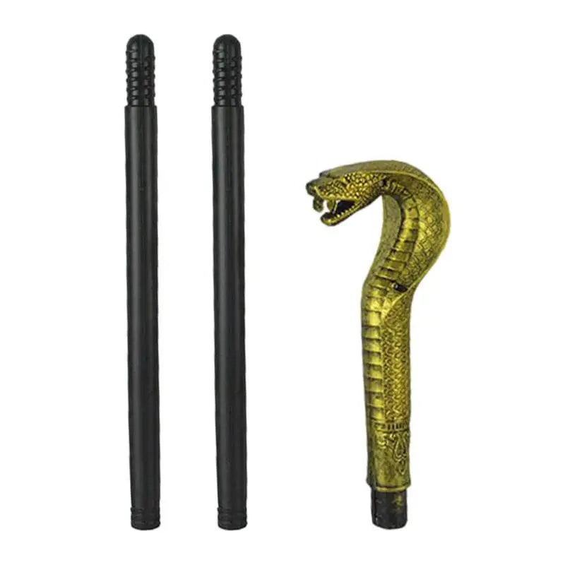 Two black sticks alongside a golden snake-shaped handle with detailed scales and an open mouth, resembling a cobra's hood.