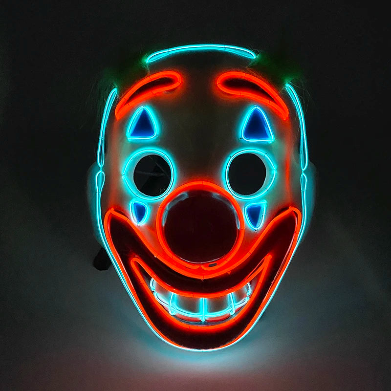 Glowing clown mask with bold red and blue neon outlines, featuring exaggerated facial features including a large nose, open eyes, and a wide, smiling mouth set against a dark background.
