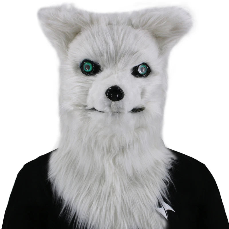 Anthropomorphic white wolf costume head with fluffy fur and striking green eyes, worn over a black outfit.