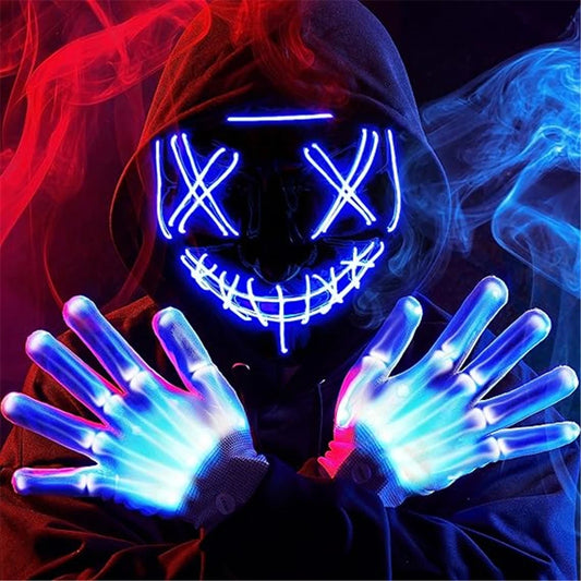 Person in a dark hoodie wearing a glowing neon mask with a stitched smile and X eyes. Their hands are crossed, adorned with bright blue light-up gloves, surrounded by colorful wisps of smoke.