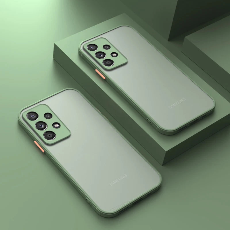 Two green smartphones with triple rear cameras and a sleek design, resting on a green geometric surface, highlighting their stylish and minimalistic aesthetic.