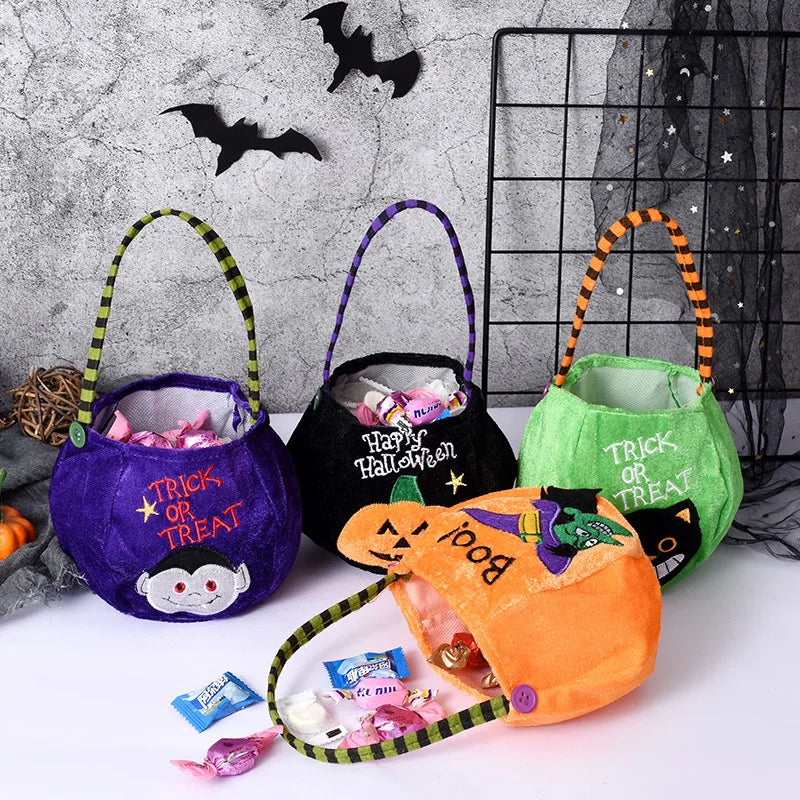 Four Halloween-themed candy bags filled with treats are displayed. The bags are purple, black, green, and orange, with festive designs and "Trick or Treat" text. Black bats adorn the wall.