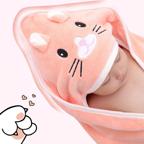 Baby wrapped in a soft, peach-colored animal-themed hooded towel, featuring a cute face with ears and whiskers. A cartoon paw with hearts is in the corner on a pink background.