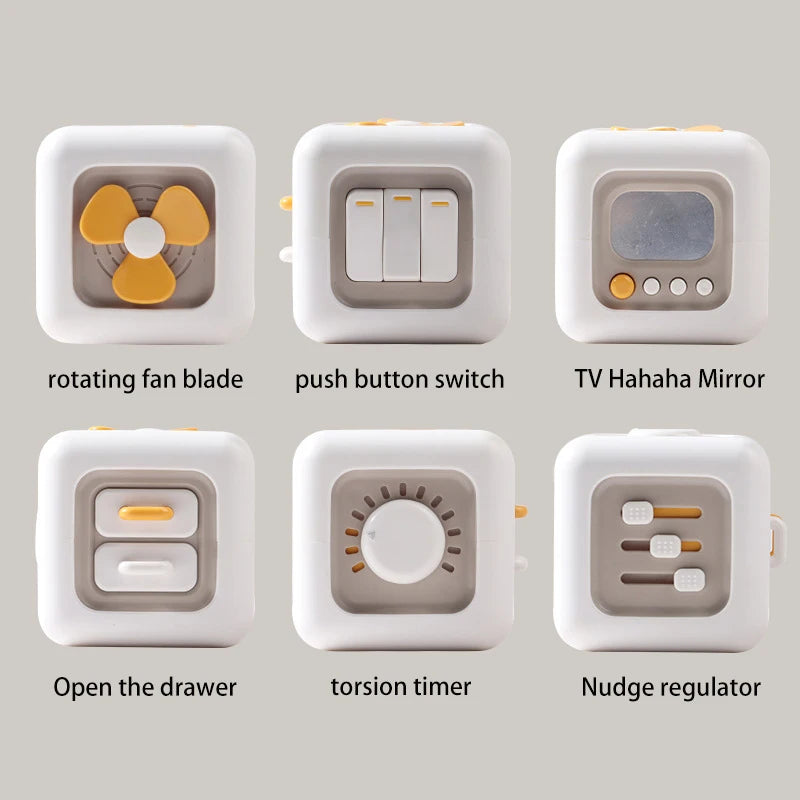 White cubes with various features: rotating fan blade, push button switch, TV Hahaha Mirror, open drawer, torsion timer, and nudge regulator against a light background.