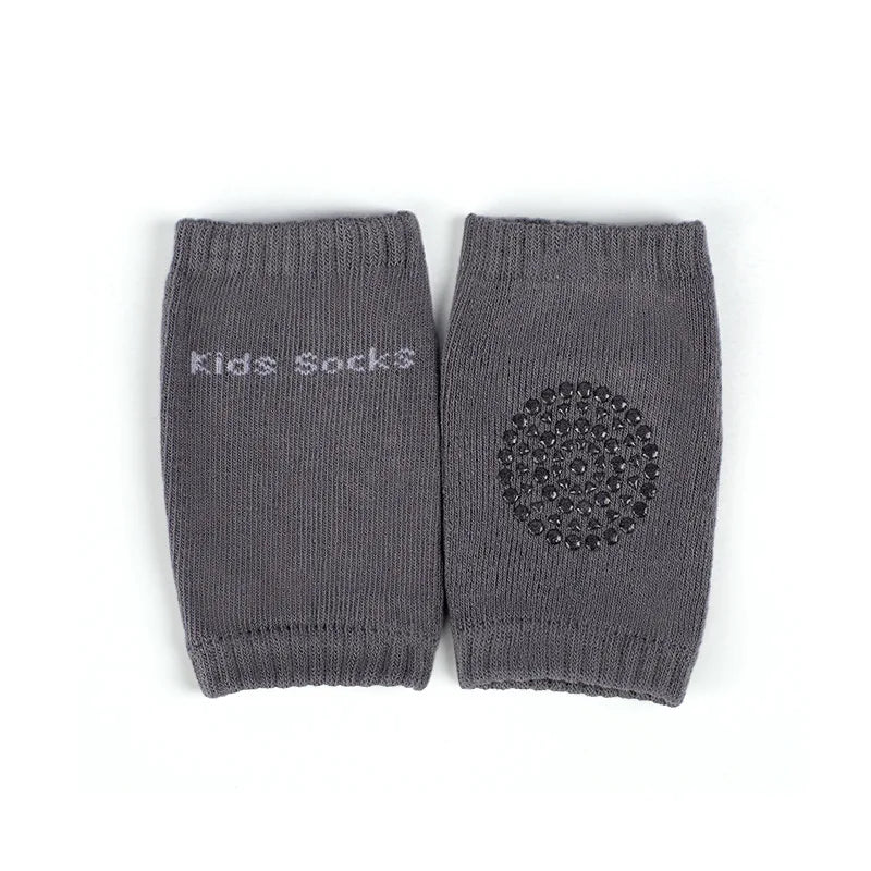 Gray kids' socks with "Kids Socks" text on one and a non-slip circular pattern on the other.