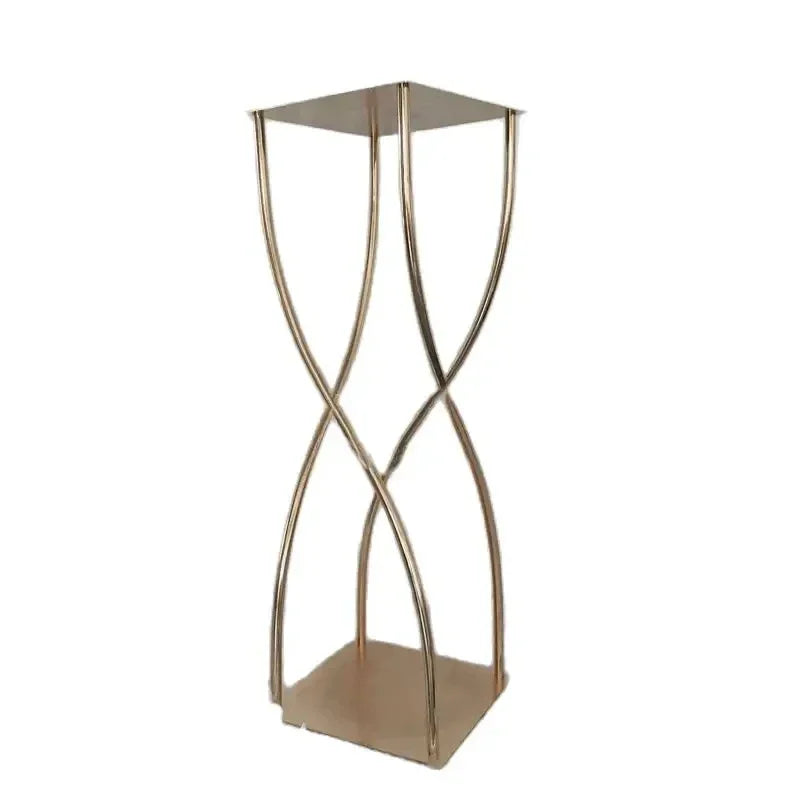 Elegant gold plant stand with a square top and twisted wire design, sitting on a square base. Perfect for modern decor and showcasing plants.