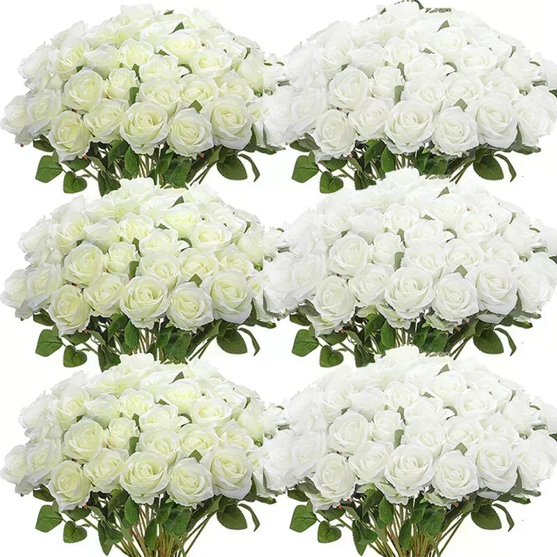 Six bouquets of white roses with green leaves arranged in two rows, creating a lush and symmetrical display. The petals have a soft ivory tint, enhancing the floral elegance.