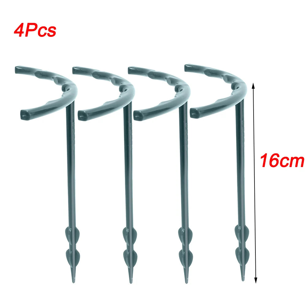 Close-up of four gray plastic ground stakes, 16 cm in length, each with a curved top and screw-like base for securing objects. Text on the image indicates "4Pcs" and "16cm" in red.