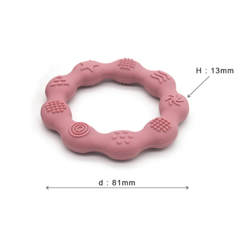 Pink silicone teething ring with textured patterns, measuring 81mm in diameter and 13mm in height.