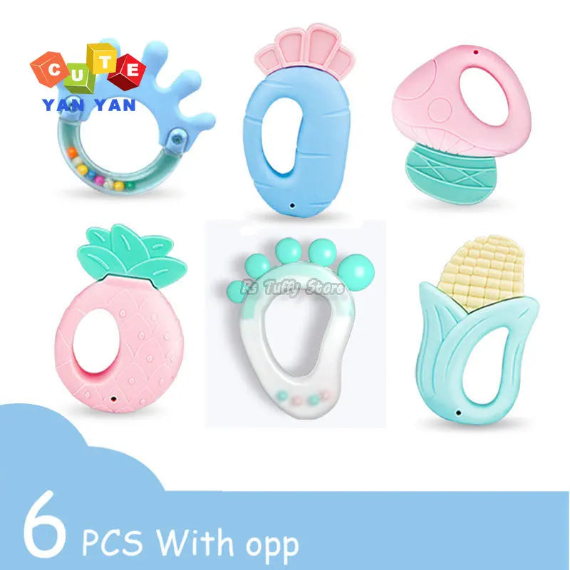 Six colorful baby teethers in various shapes: dinosaur, mushroom, pineapple, foot, corn, and one with beads. "6 PCS With opp" text and "CUTE YAN YAN" logo included.