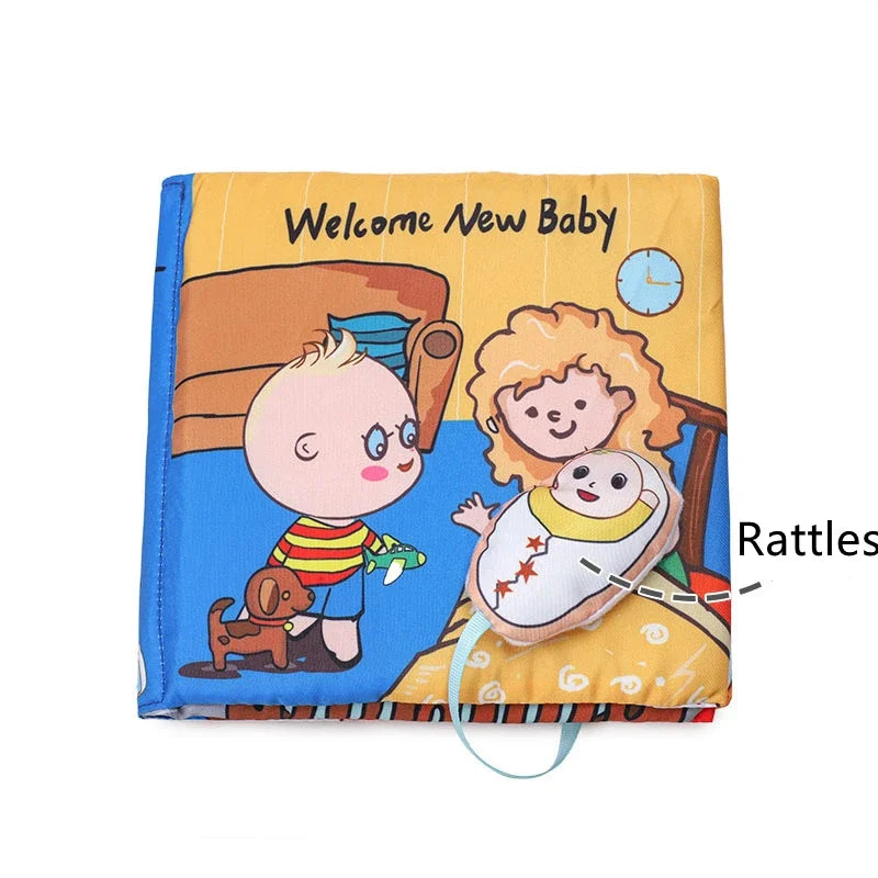 Children's fabric book cover with "Welcome New Baby" text, featuring a cartoon baby, a parent, and a rattle. The scene includes a crib, clock, and a child holding a toy airplane.