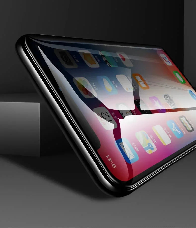 Close-up of a smartphone with a cracked screen, displaying colorful app icons. The phone is placed on a dark surface, highlighting the curved edges and screen damage.