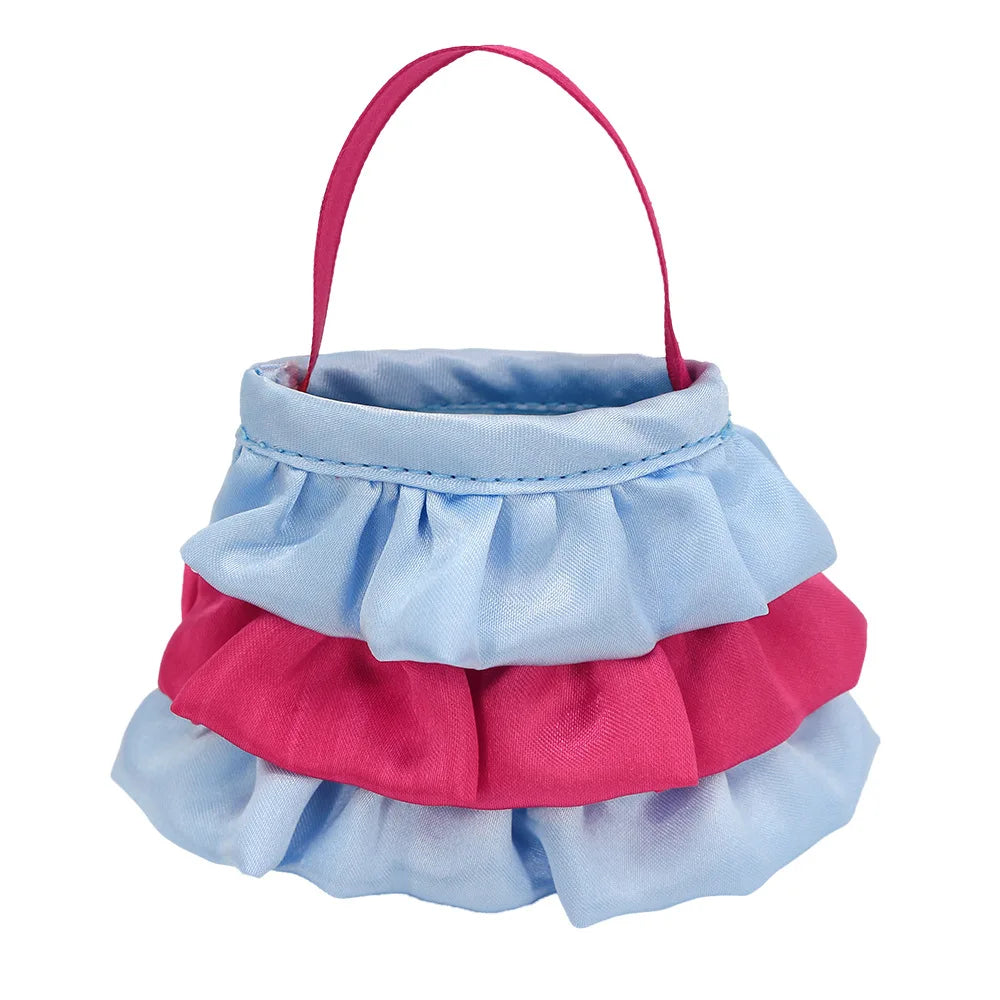 Mini handbag with tiered ruffles in blue and pink fabric. Features a simple pink strap, creating a playful, textured look.