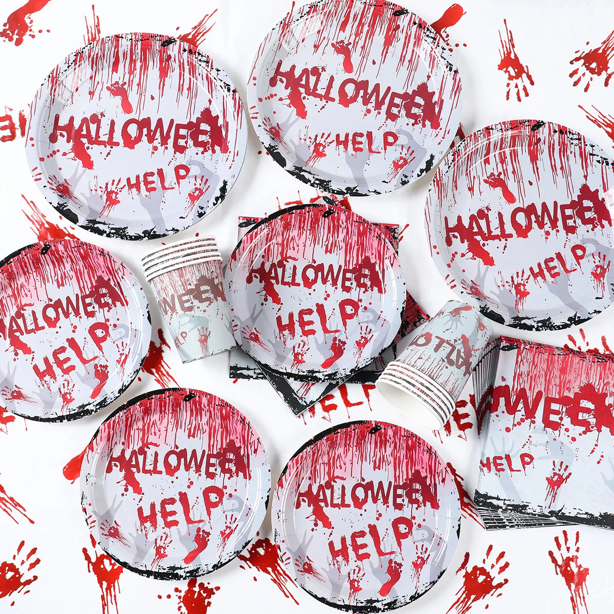 Halloween-themed plates and cups with "HELP" and blood splatter design, surrounded by matching napkins and red handprint decorations, creating a spooky party setup.
