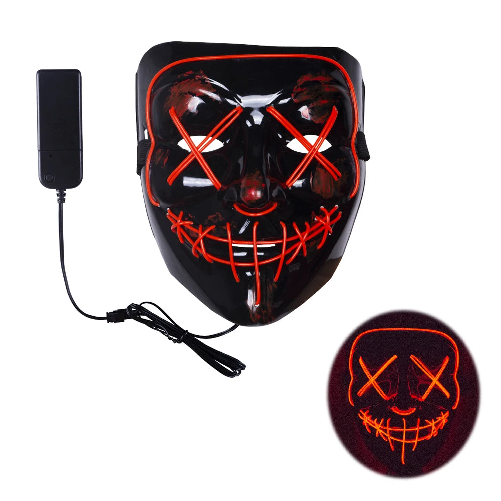 Black mask with red LED lights forming Xs over the eyes and a stitched mouth pattern, connected to a battery pack. Inset shows the mask glowing in darkness.
