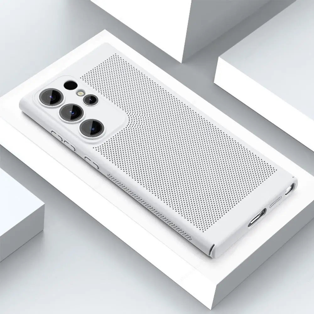 A white phone case with a perforated design lies on a geometric white surface. It features cutouts for three camera lenses, flash, buttons, and a charging port.