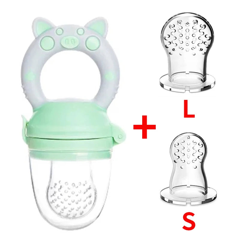 Baby food feeder with green silicone handle shaped like cat ears. Includes two transparent silicone nipples in large and small sizes, marked with "L" and "S".