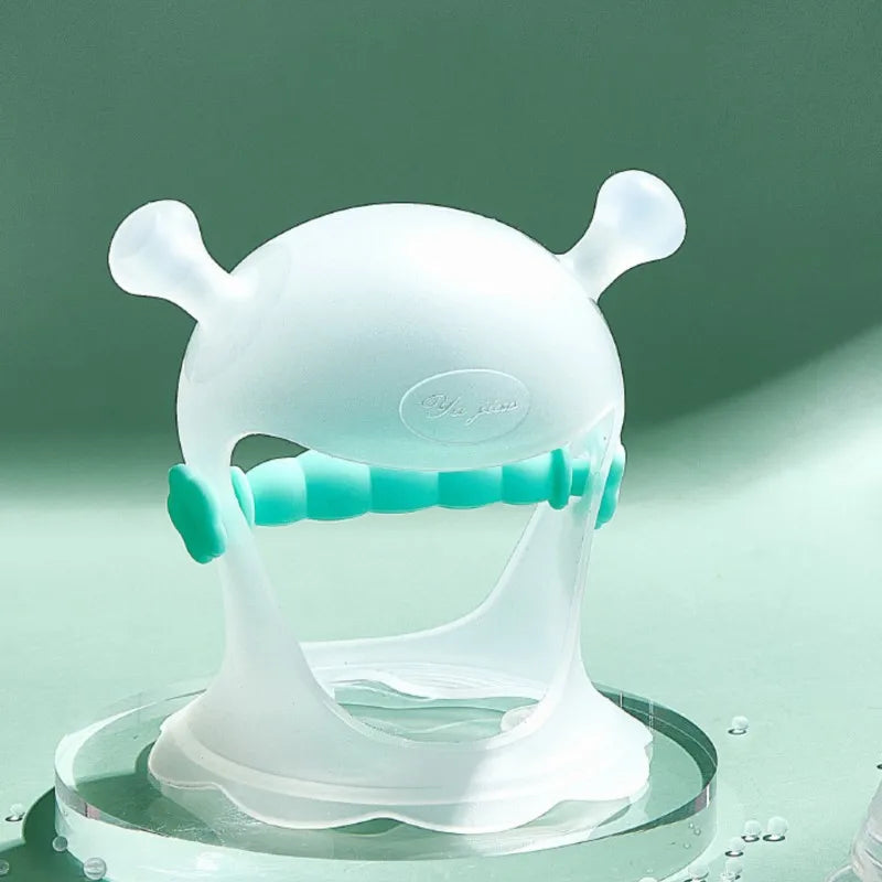 A futuristic, translucent white and teal device with antennae-like protrusions, set against a soft green background. It rests on a clear, circular base with water droplets nearby.