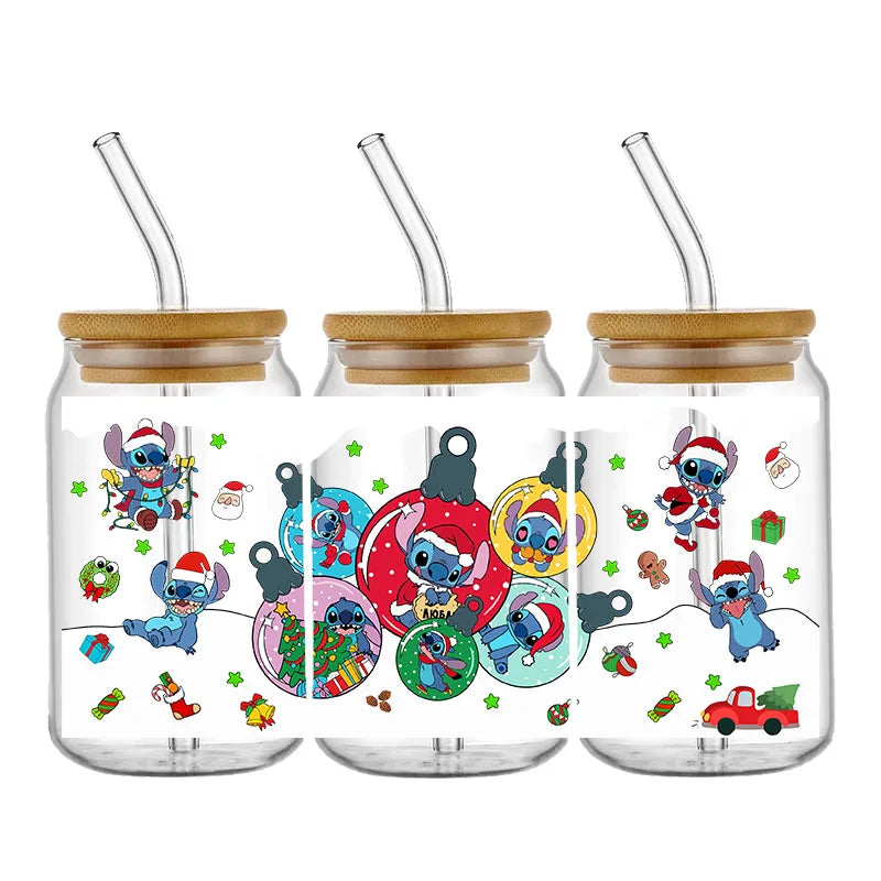 Three glass jars with bamboo lids and straws, decorated with Christmas-themed cartoon characters in festive outfits, surrounded by ornaments and holiday symbols.