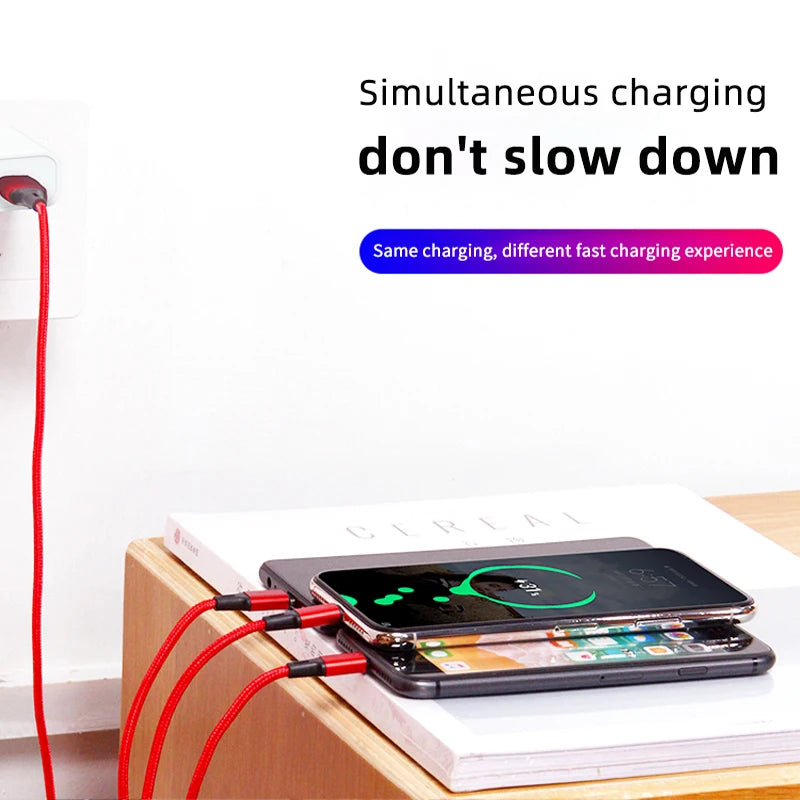 Two smartphones charge simultaneously using red cables plugged into a wall socket. The image text reads, "Simultaneous charging, don't slow down." The phones are on a wooden surface.