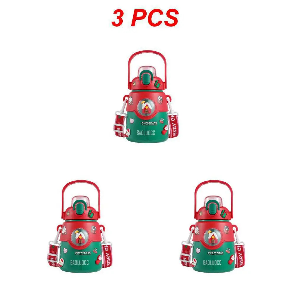 Three festive green and red Christmas-themed containers with handles and Christmas graphics. Each has a "BAOLUOCC" label and "MERRY CHRISTMAS" tags. Text above reads "3 PCS".