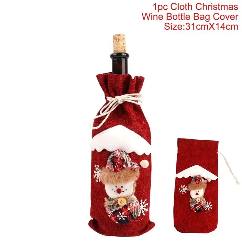 Red cloth wine bottle cover featuring a snowman design with a plaid hat and scarf, accented with white felt snow and snowflakes. Size: 31cm x 14cm.