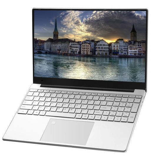 Silver laptop with a scenic cityscape wallpaper featuring a river, historic buildings, and a church with a tall steeple under a cloudy sky at sunset.