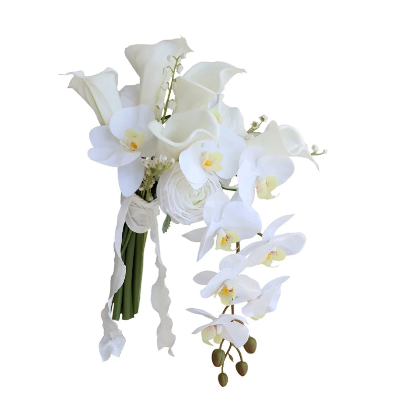 A bouquet of white flowers, including calla lilies and orchids, with green stems and delicate ribbon accents. The arrangement features cascading blooms and buds.