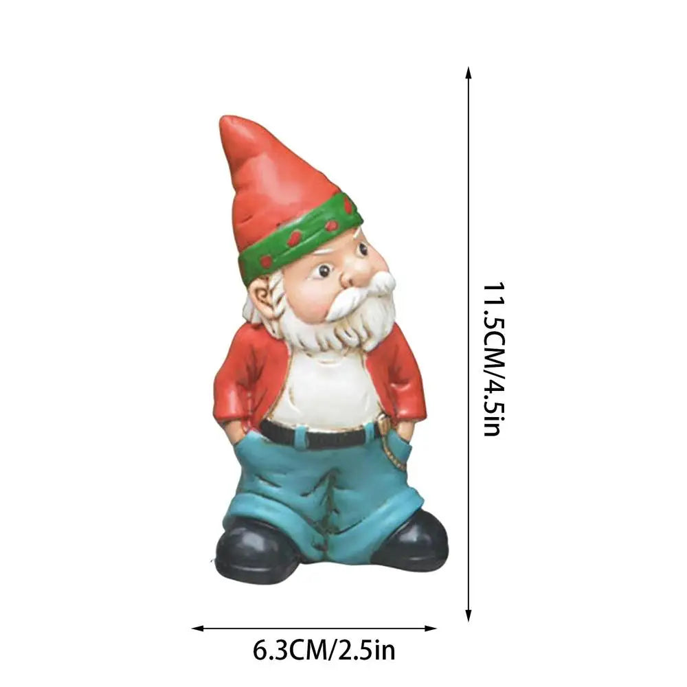 Small gnome figurine with a red hat, white beard, red jacket, and blue pants. Dimensions are shown: 11.5 cm tall and 6.3 cm wide.