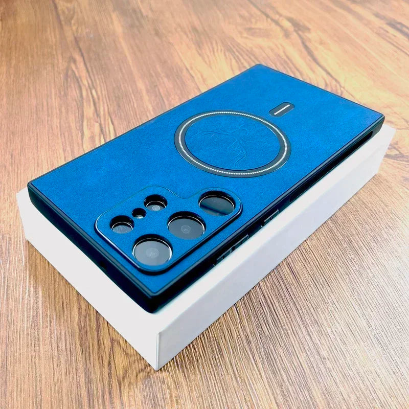 Blue smartphone with a circular design on its back and a multi-lens camera, placed on a white box on a wooden surface.
