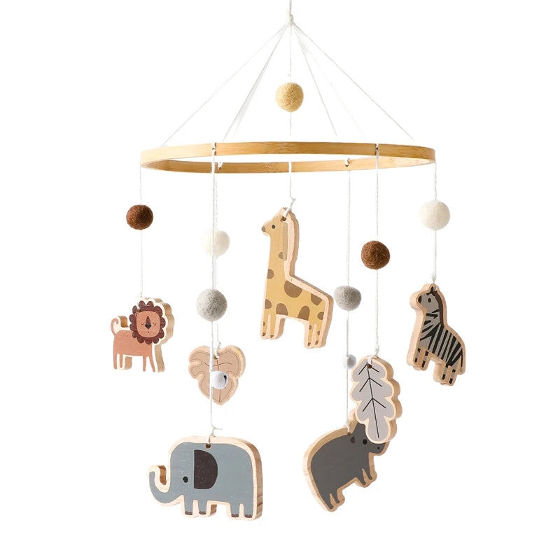 Wooden baby mobile featuring cute jungle animals: a lion, giraffe, zebra, elephant, and rhino, hanging from a wooden hoop with felt balls in neutral colors.