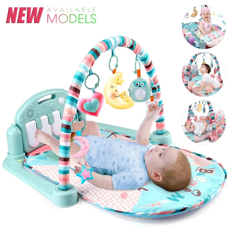 Baby lying on a colorful play gym with a piano and hanging toys, including a heart, moon, and owl. Inset images show different play positions and features.