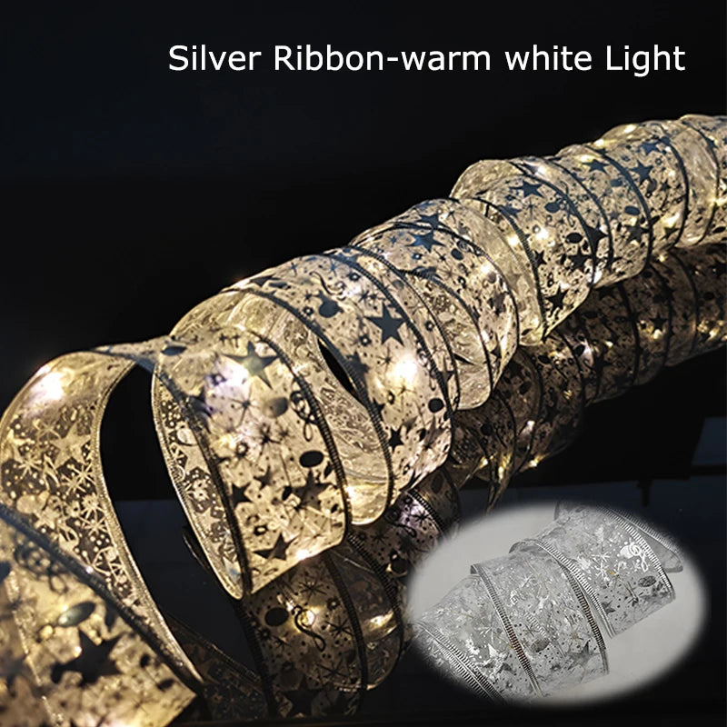 Silver ribbon with warm white lights and star patterns, coiled on a reflective surface. Inset shows a close-up of the ribbon's intricate design. Text reads "Silver Ribbon-warm white Light."