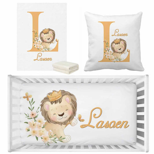 Nursery set with a cute lion wearing a crown. Includes a blanket, pillow, and wall art with "L" and floral elements. The crib sheet says "Lasoen" with matching lion design.
