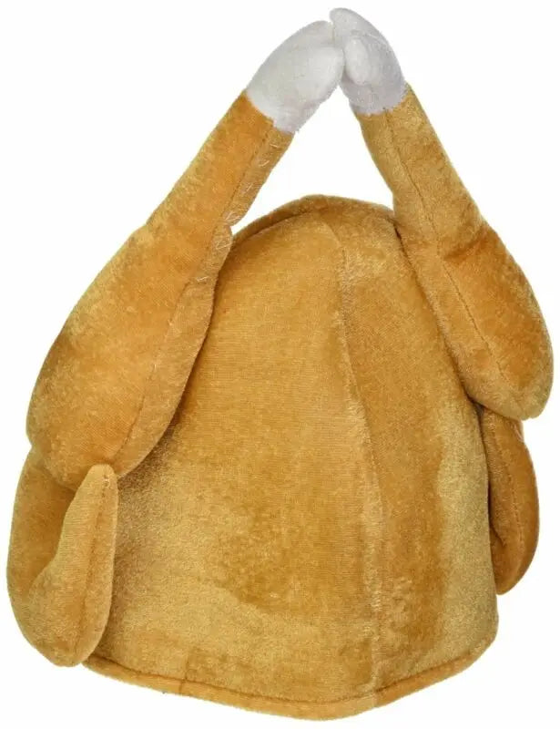Plush hat resembling a roasted turkey with drumsticks on top, designed to look like a cooked bird. The hat is brown with white ends on the drumsticks.