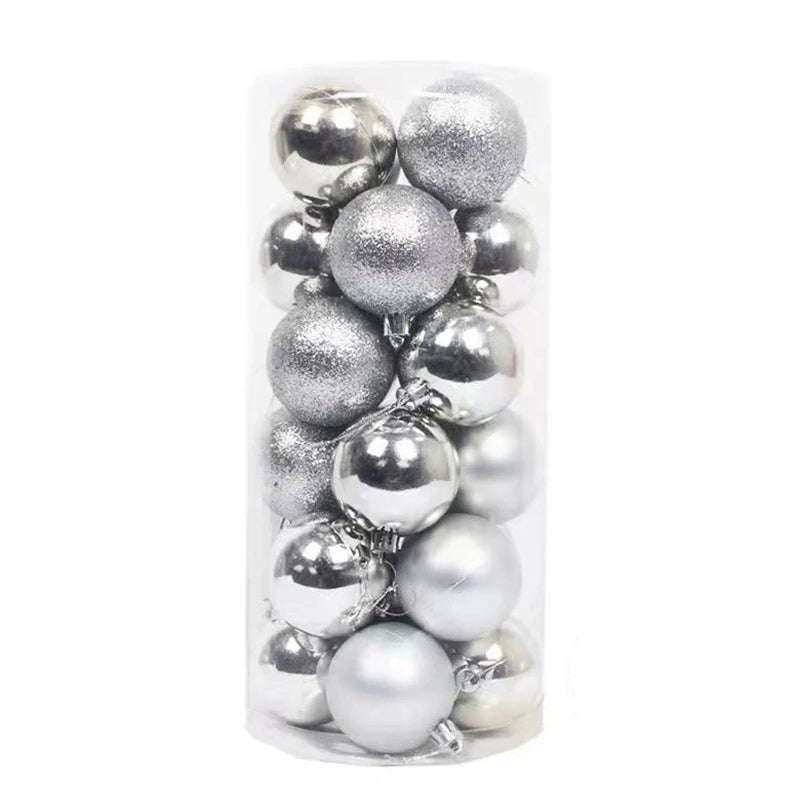 A clear cylindrical container filled with assorted silver Christmas baubles, featuring shiny, glittery, and matte textures.