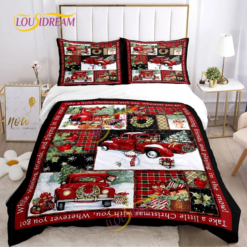 Quilt set with festive red trucks, snowmen, and Christmas themes covers a bed. Matching pillows feature similar patterns. Room includes a flower vase, wall art, and a lamp.