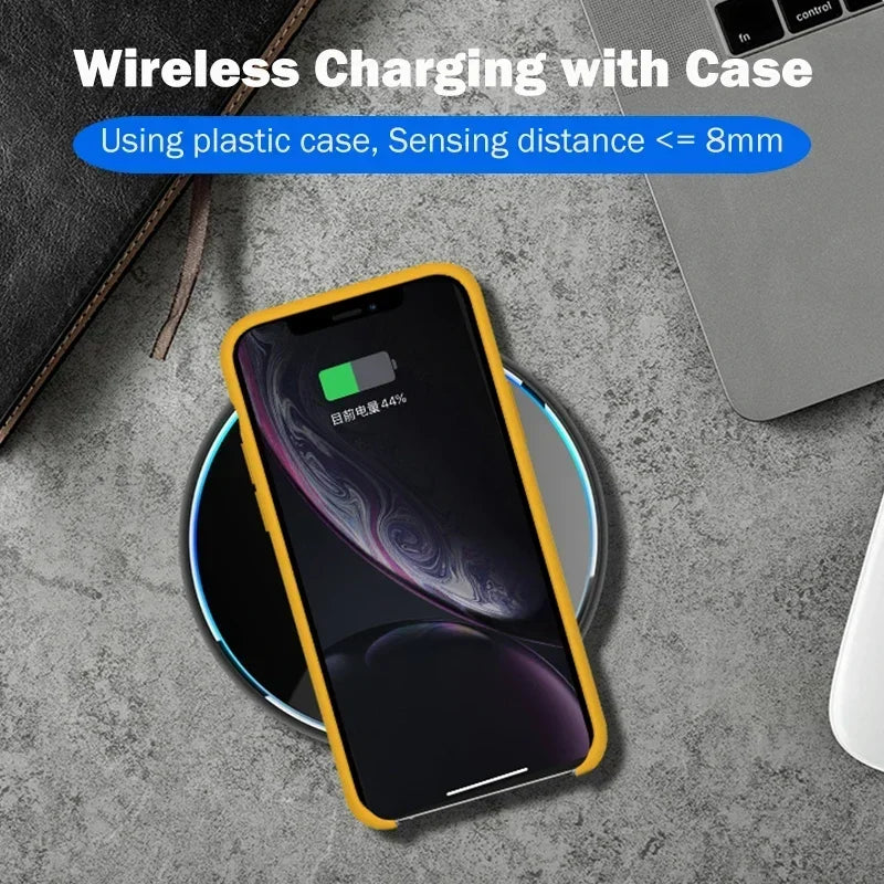 Smartphone in a yellow case on a wireless charging pad showing 44% battery. Text above reads "Wireless Charging with Case, Sensing distance <= 8mm." A laptop is nearby.