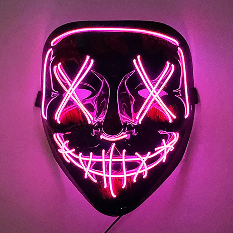 Neon mask with pink glowing lines on a black surface, featuring X-shaped eyes and a stitched smile, creating a dramatic, eerie effect.