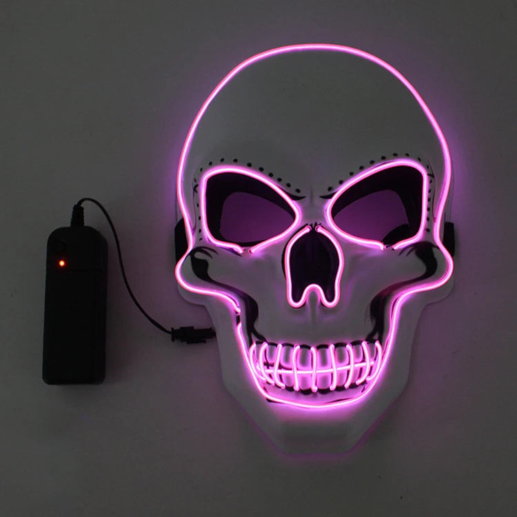 Glowing skull mask outlined with pink neon lights, featuring black eye sockets and a nose. A connected black battery pack with a red indicator light is visible.