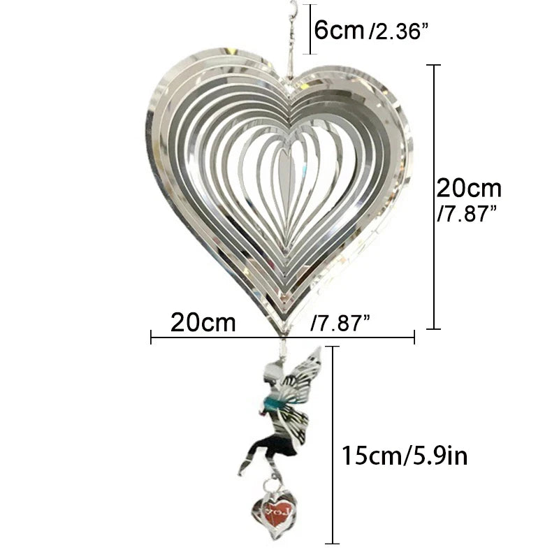 Silver heart wind spinner with a 3D layered design, measuring 20cm in width and height. Below hangs a fairy figure and a small heart ornament labeled "love", measuring 15cm.