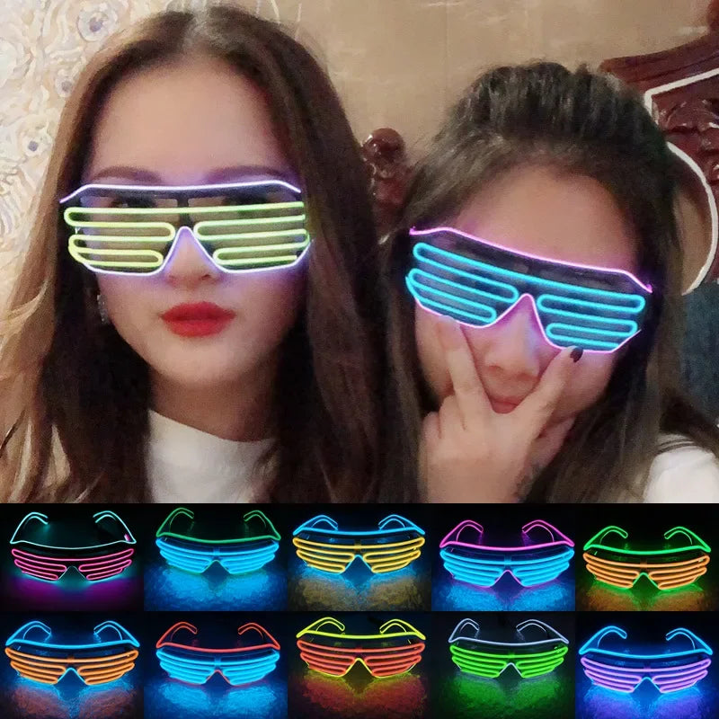Two individuals wearing glowing neon shutter shades, one pair in green and purple, the other in blue and pink. Below, there are various neon glasses in different colors.