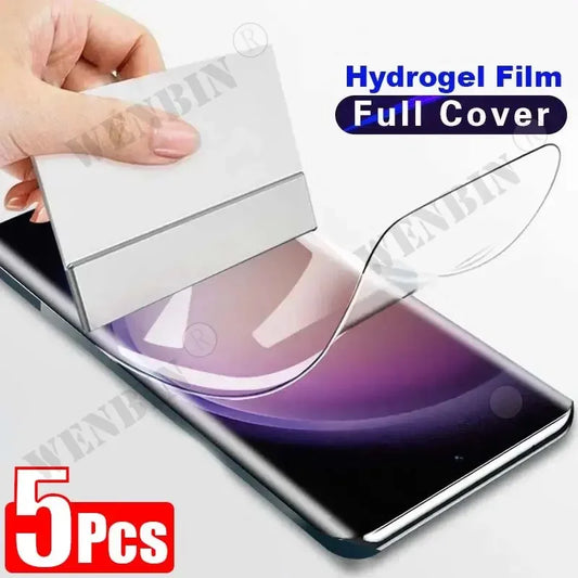Hand applying a transparent hydrogel film onto a smartphone screen with text "Hydrogel Film Full Cover" and "5PCS" in red, indicating a pack of five screen protectors.
