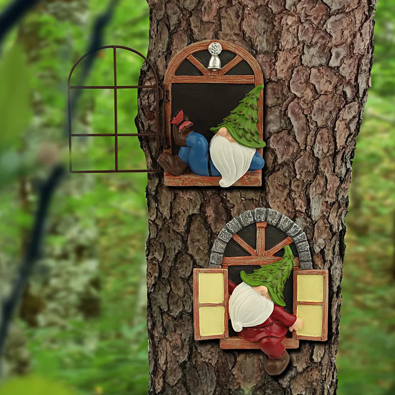 Decorative tree ornaments feature two gnomes with green hats: one reclining by a window and another peering into one. Both are set against a tree trunk with open window shutters.