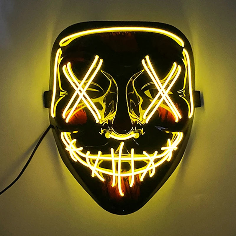 A glowing mask with neon yellow lines forms X shapes over the eyes, a stitched mouth, and a curved brow on a dark background, emitting an eerie light.