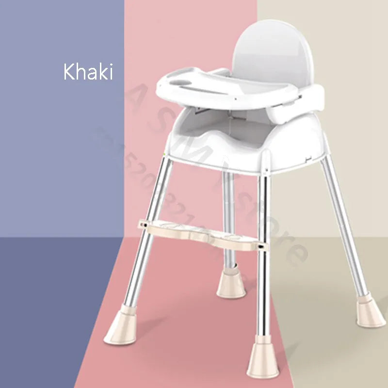 A modern white high chair with a tray and silver legs, placed on a floor with pink, blue, and khaki color blocks. The word "Khaki" is written in the top left corner.