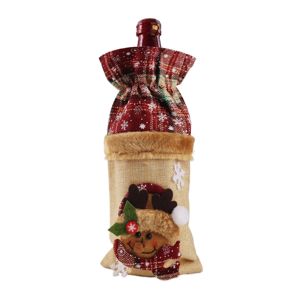 Festive wine bottle dressed in a red plaid and beige cover with a reindeer face, snowflakes, and faux fur details, creating a charming holiday presentation.